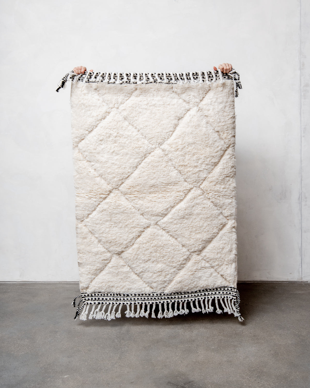 Modern, designer, handcrafted Berber rug from Morocco. Beniourain carpet with minimalist design, natural wool pile and a fluffy texture.