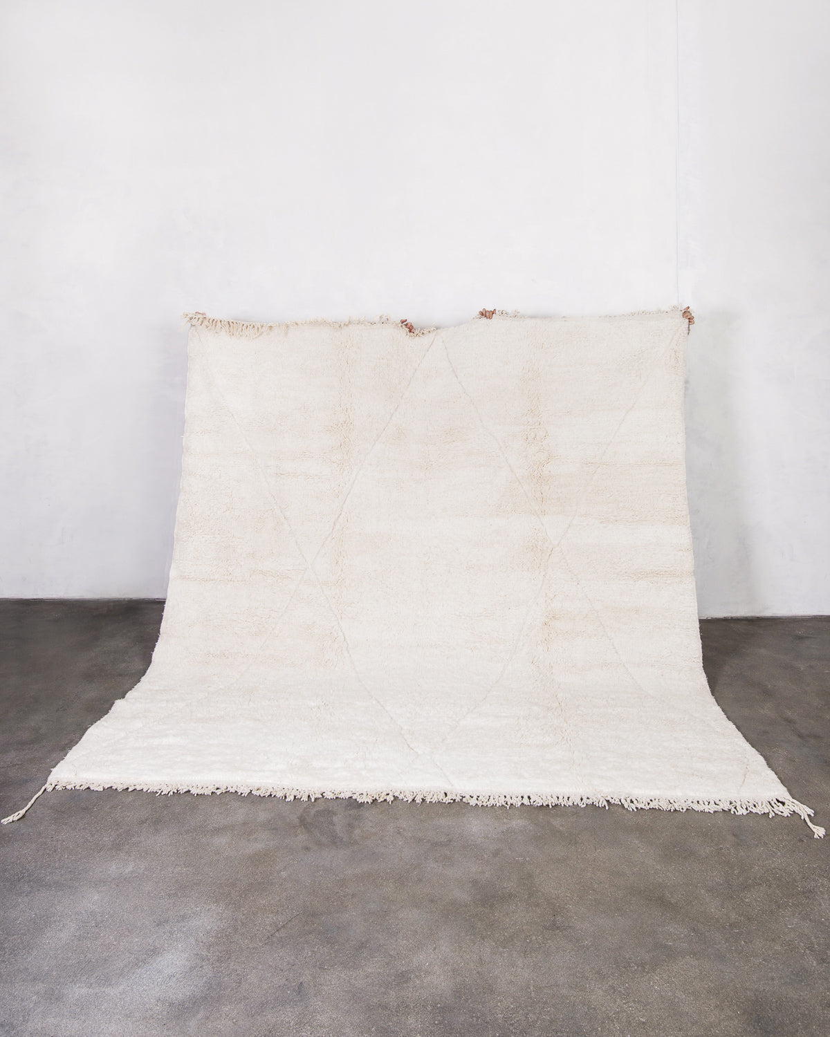 Modern, designer, handcrafted Berber rug from Morocco. Beniourain carpet with minimalist design, natural wool pile and a fluffy texture.