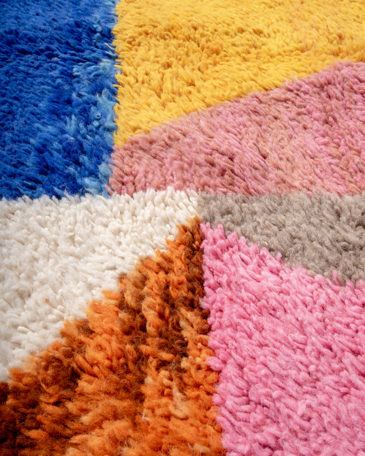 Modern, designer, handcrafted Berber rug from Morocco. Beniourain carpet with beautiful colours and patterns and fluffy wool texture.