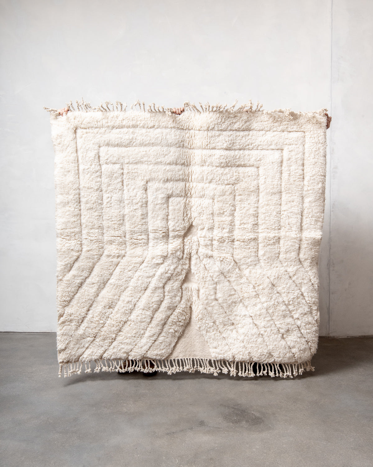 Modern, designer, handcrafted Berber rug from Morocco. Beniourain carpet with minimalist design, natural wool pile and a fluffy texture.