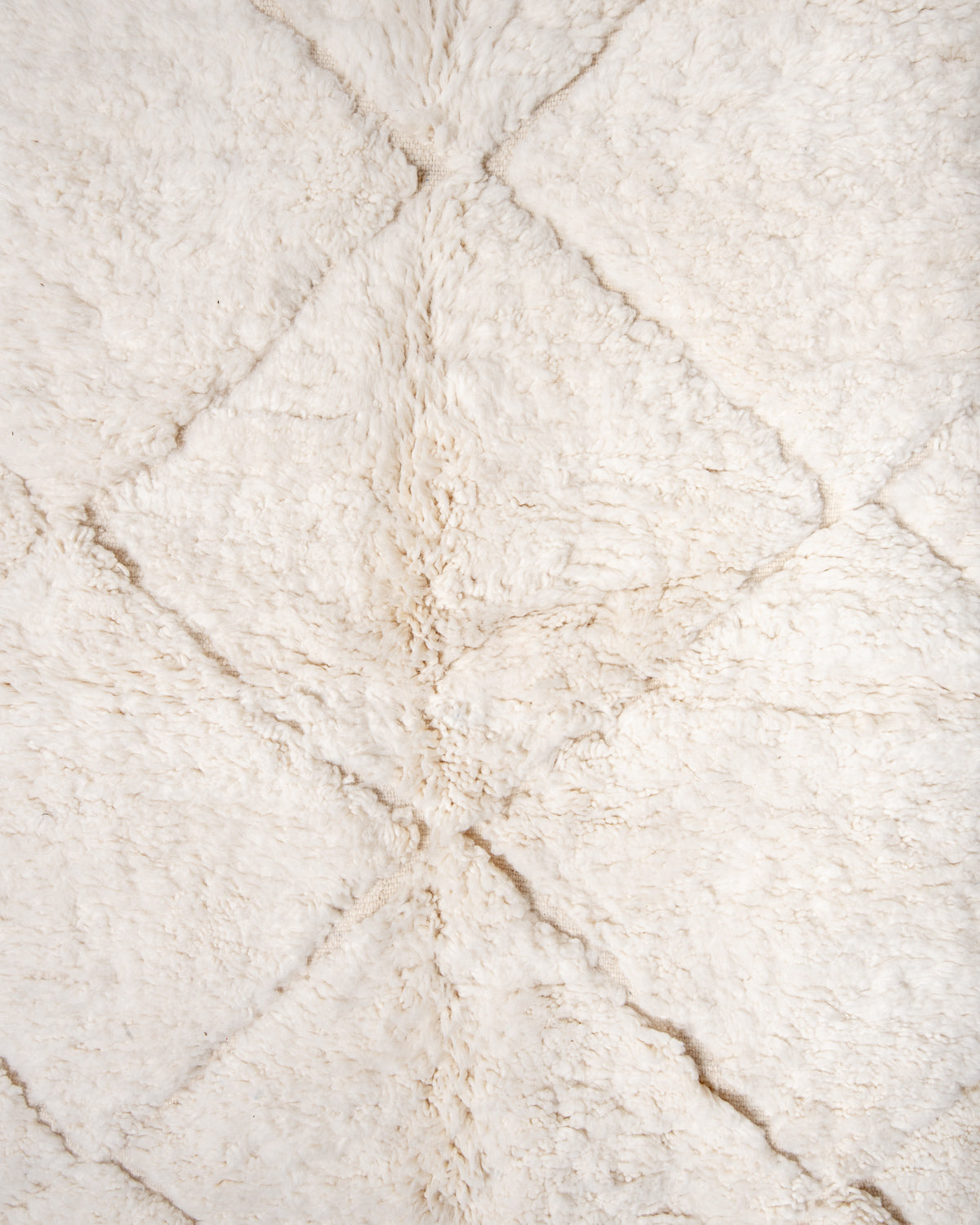 Modern, designer, handcrafted Berber rug from Morocco. Beniourain carpet with minimalist design, natural wool pile and a fluffy texture.