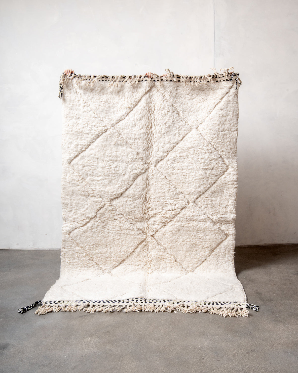 Modern, designer, handcrafted Berber rug from Morocco. Beniourain carpet with minimalist design, natural wool pile and a fluffy texture.