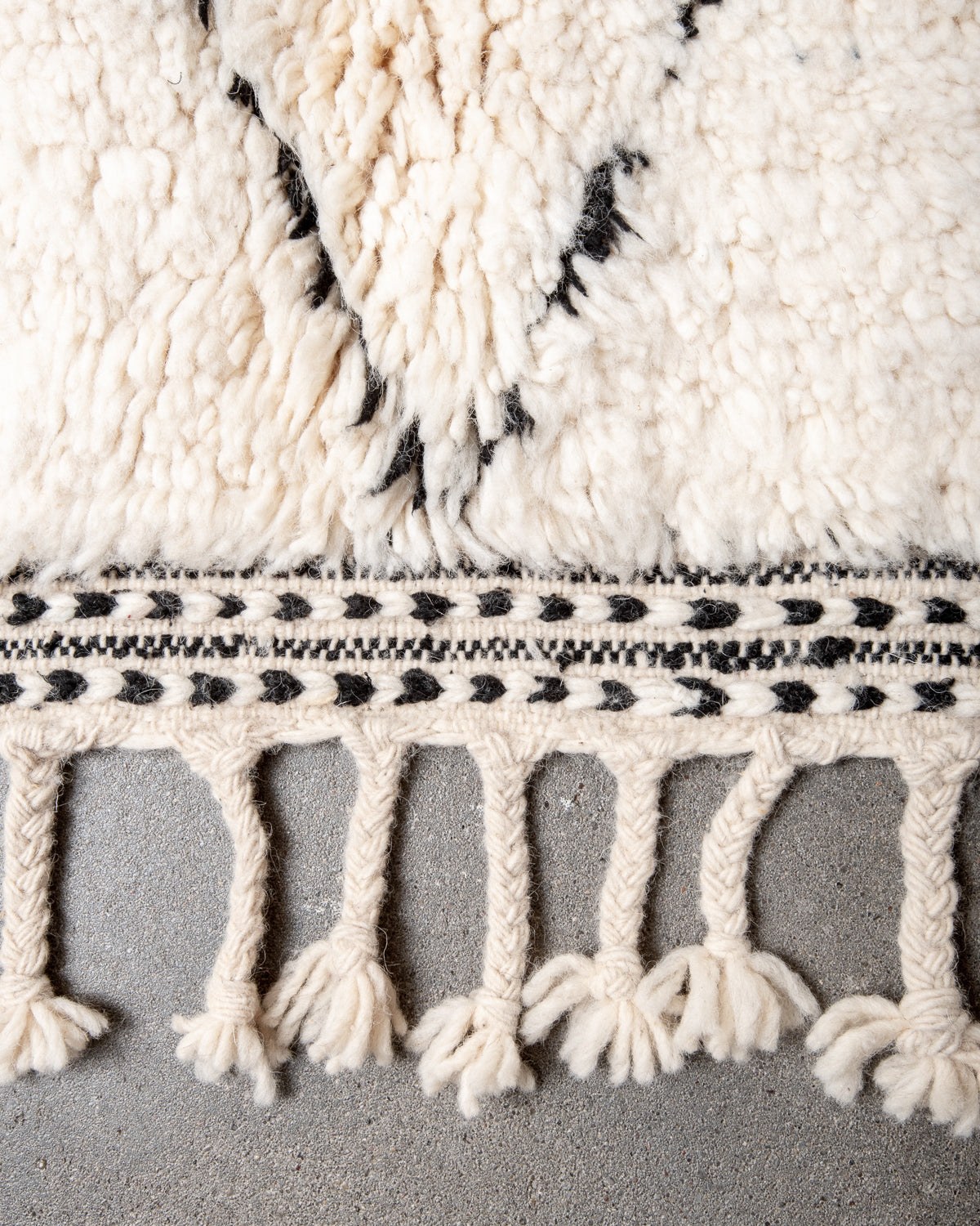 Modern, designer, handcrafted Berber rug from Morocco. Beniourain carpet with minimalist design, natural wool pile and a fluffy texture.