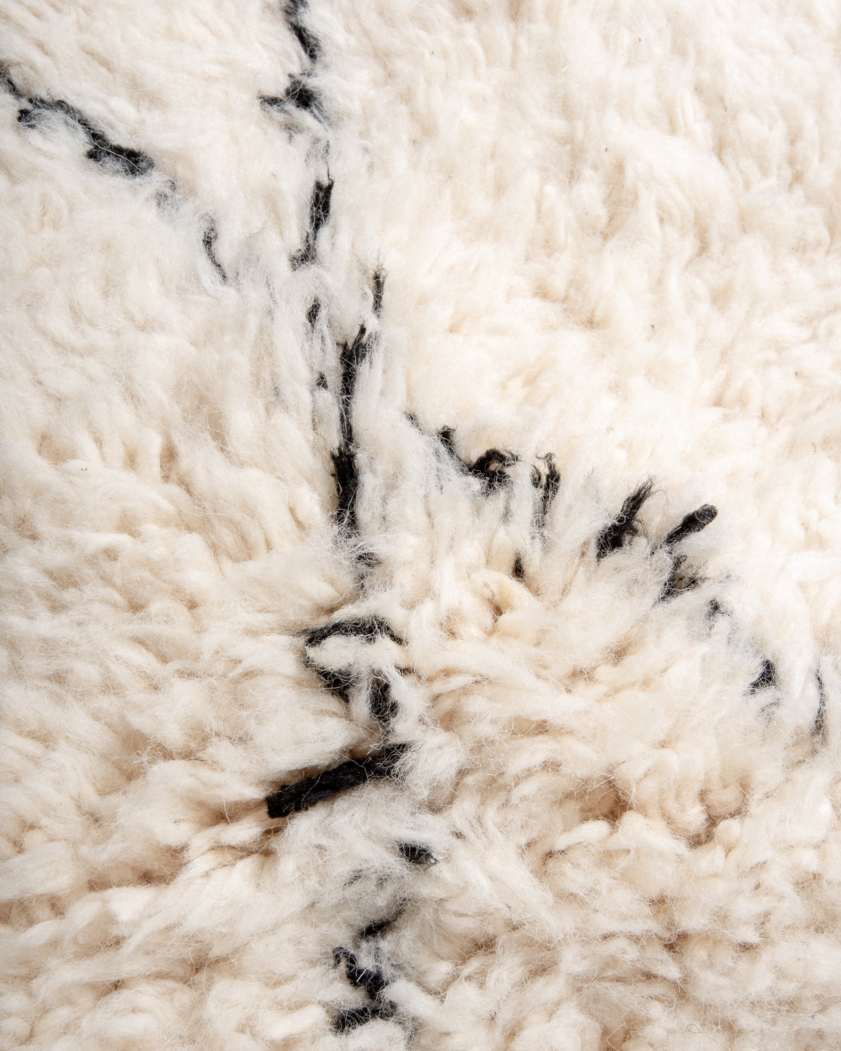 Modern, designer, handcrafted Berber rug from Morocco. Beniourain carpet with minimalist design, natural wool pile and a fluffy texture.