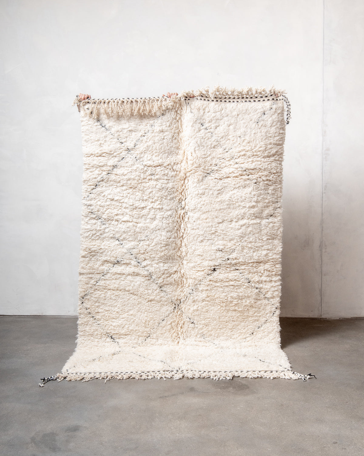 Modern, designer, handcrafted Berber rug from Morocco. Beniourain carpet with minimalist design, natural wool pile and a fluffy texture.