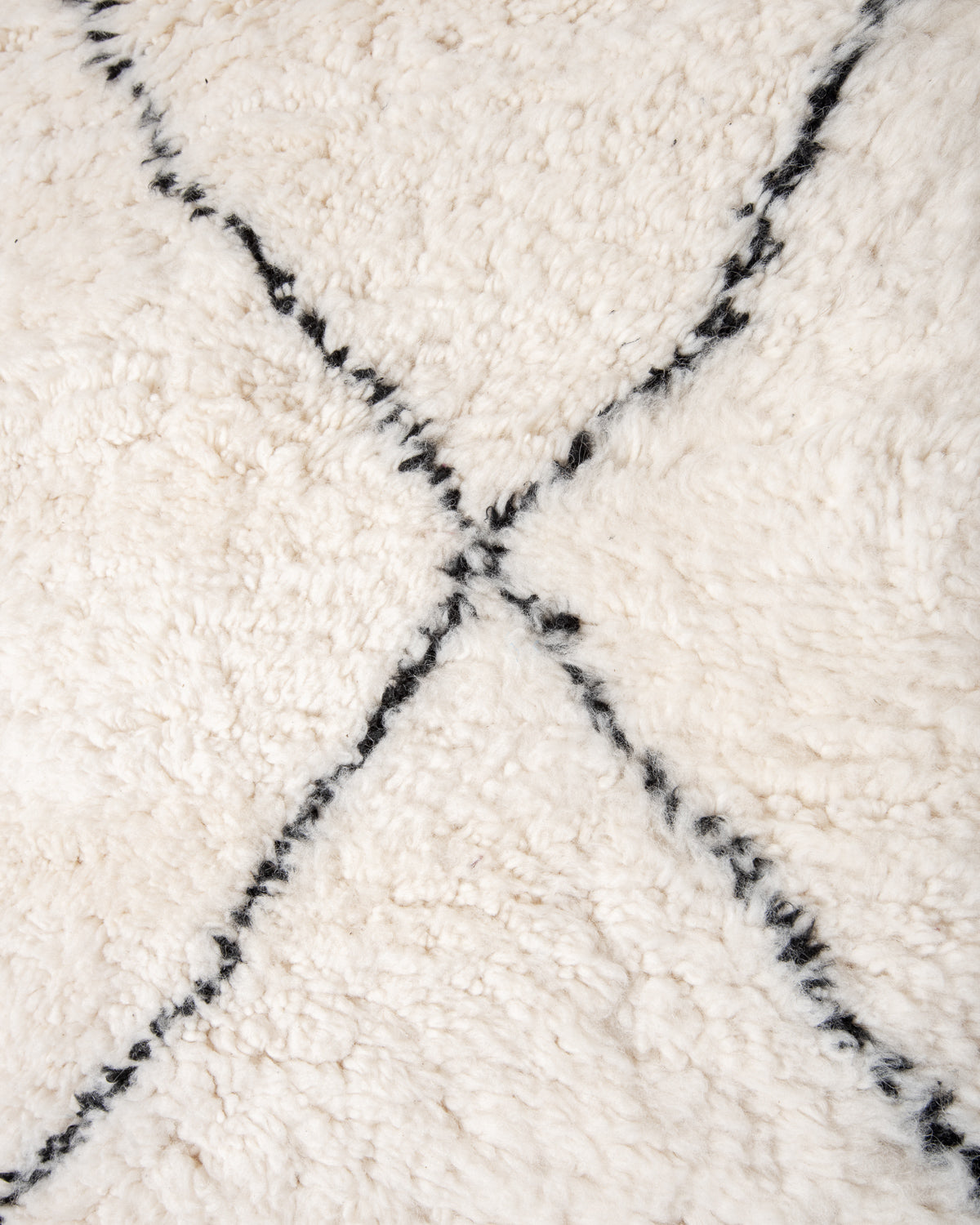 Modern, designer, handcrafted Berber rug from Morocco. Beniourain carpet with minimalist design, natural wool pile and a fluffy texture.