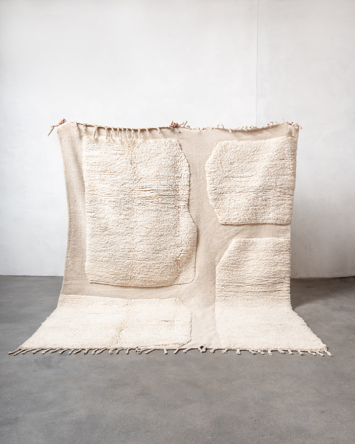 Modern, designer, handcrafted Berber rug from Morocco. Beniourain carpet with minimalist design, natural wool pile and a fluffy texture.