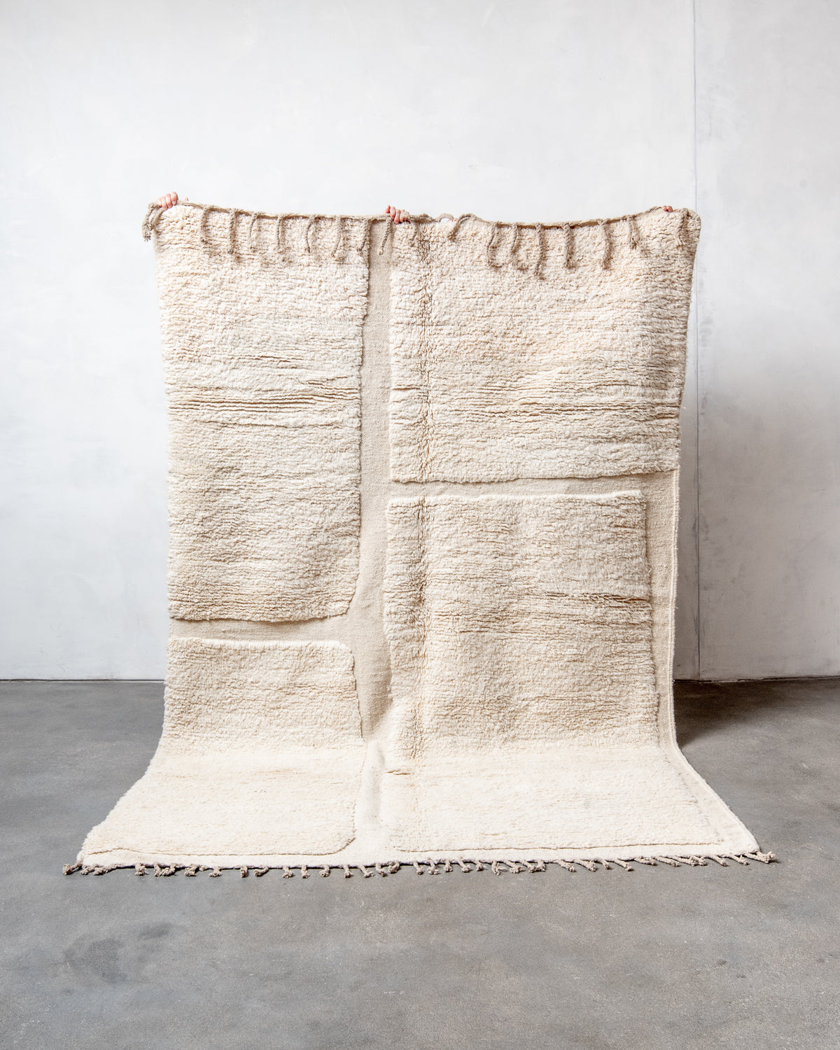 Modern, designer, handcrafted Berber rug from Morocco. Beniourain carpet with minimalist design, natural wool pile and a fluffy texture.