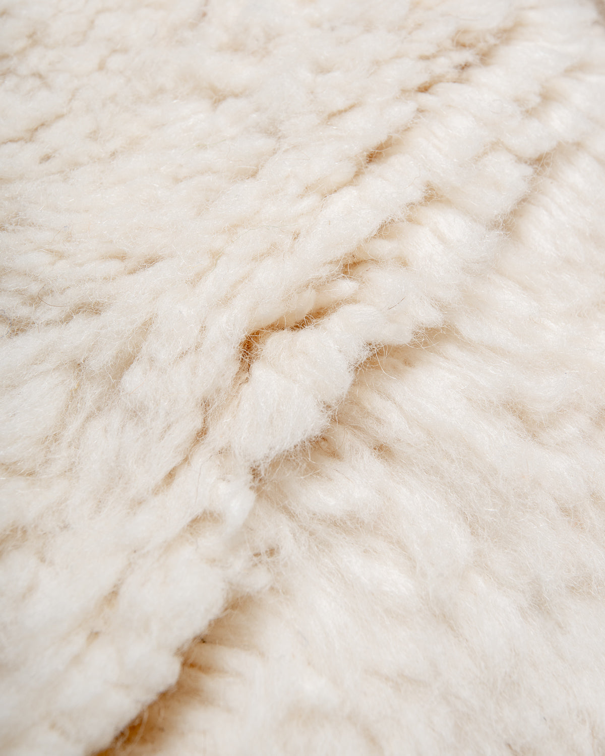 Modern, designer, handcrafted Berber rug from Morocco. Beniourain carpet with minimalist design, natural wool pile and a fluffy texture.