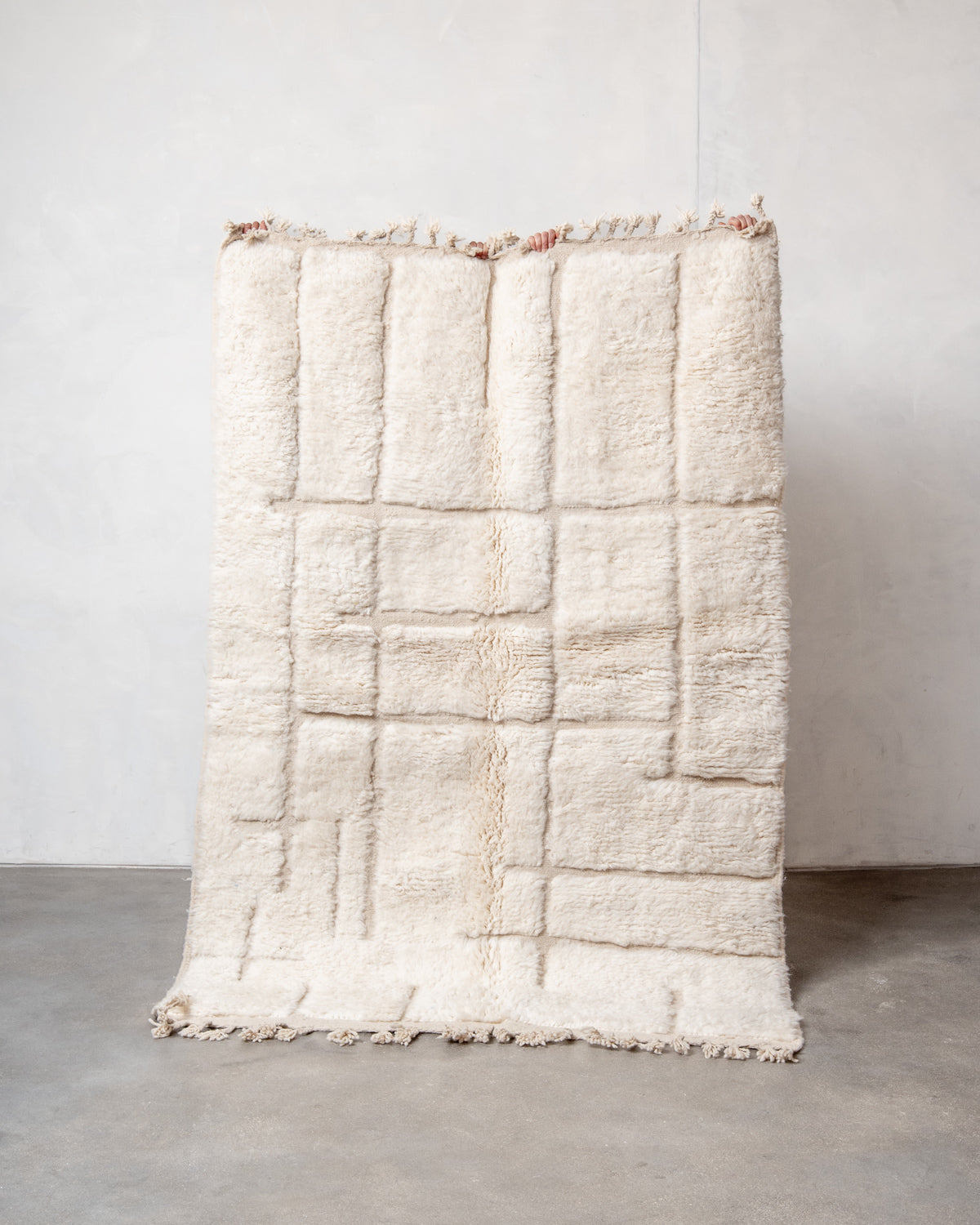 Modern, designer, handcrafted Berber rug from Morocco. Beniourain carpet with minimalist design, natural wool pile and a fluffy texture.