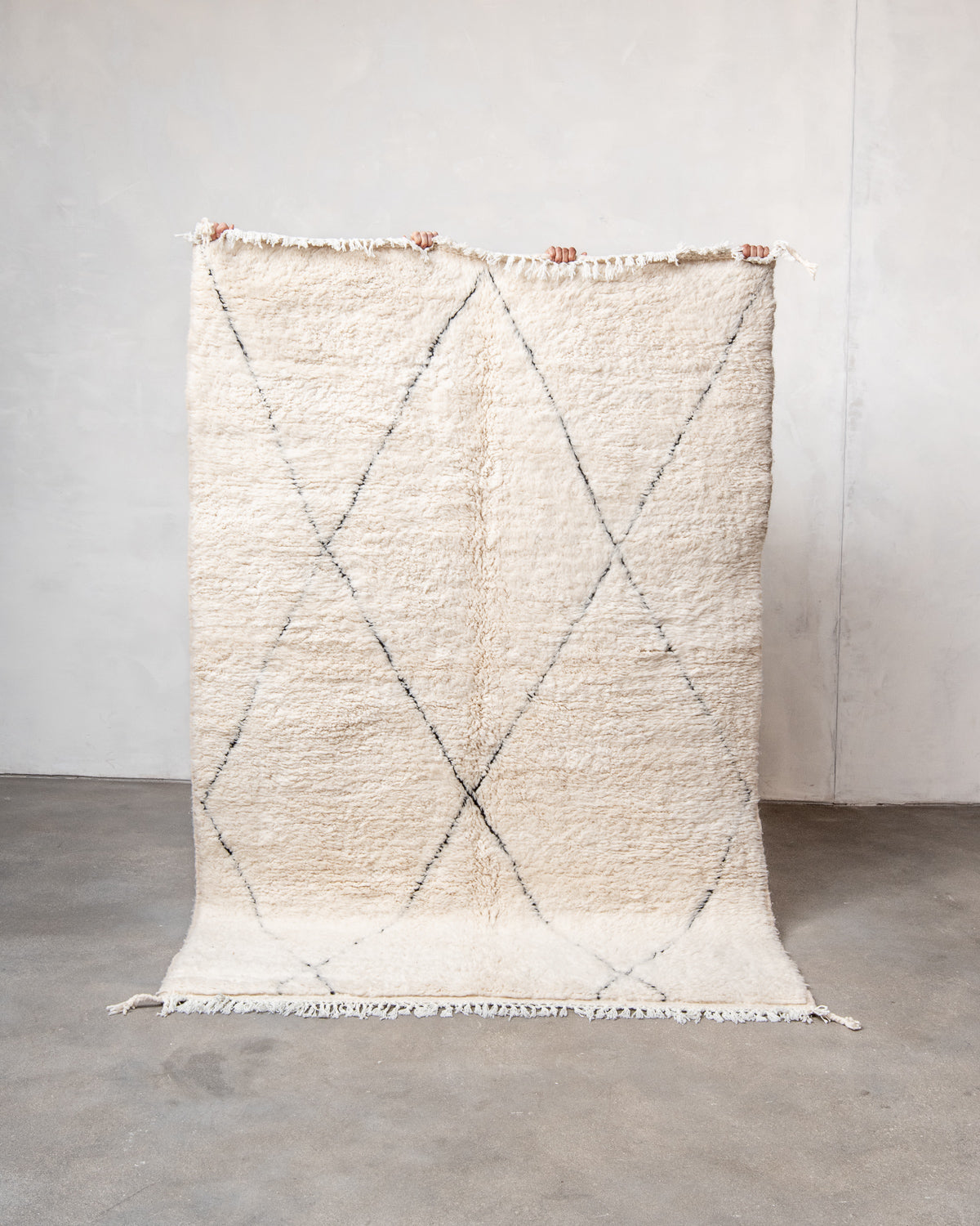 Modern, designer, handcrafted Berber rug from Morocco. Beniourain carpet with minimalist design, natural wool pile and a fluffy texture.