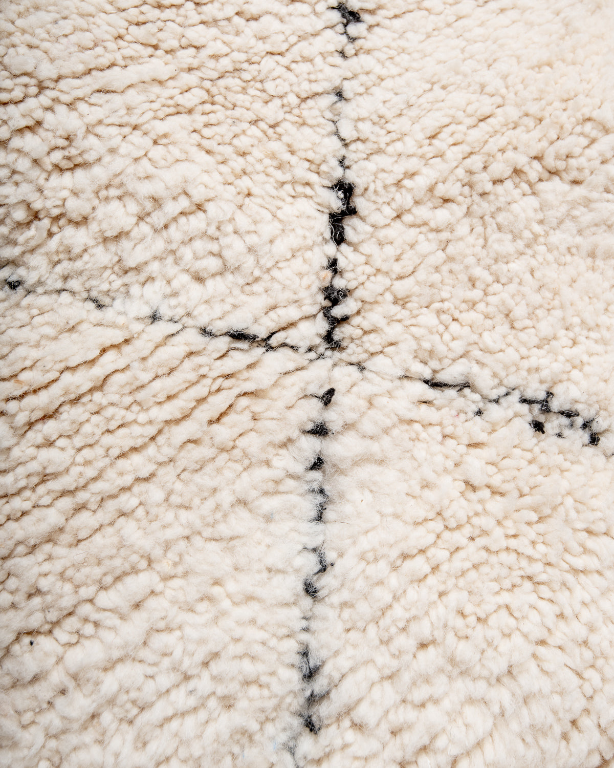 Modern, designer, handcrafted Berber rug from Morocco. Beniourain carpet with minimalist design, natural wool pile and a fluffy texture.