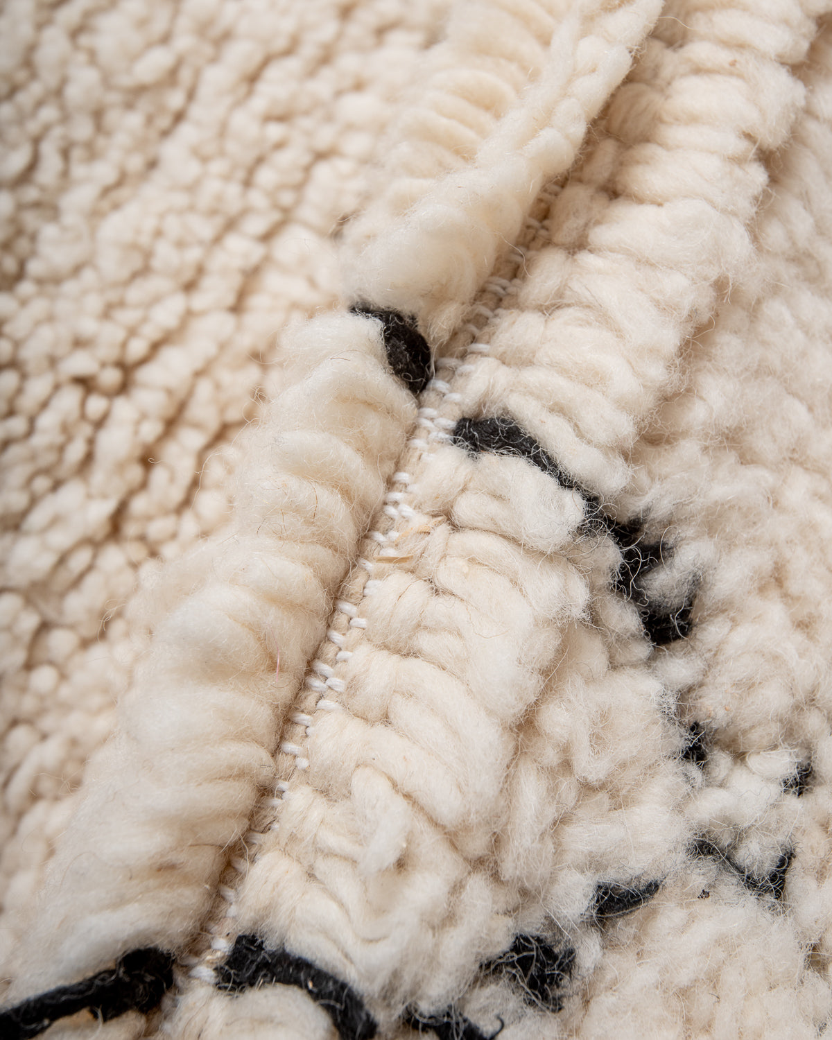 Modern, designer, handcrafted Berber rug from Morocco. Beniourain carpet with minimalist design, natural wool pile and a fluffy texture.