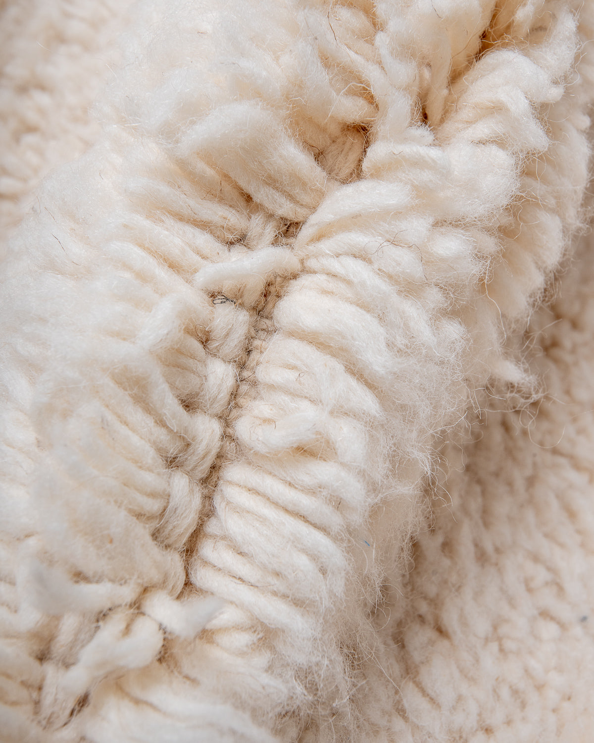 Modern, designer, handcrafted Berber rug from Morocco. Beniourain carpet with minimalist design, natural wool pile and a fluffy texture.