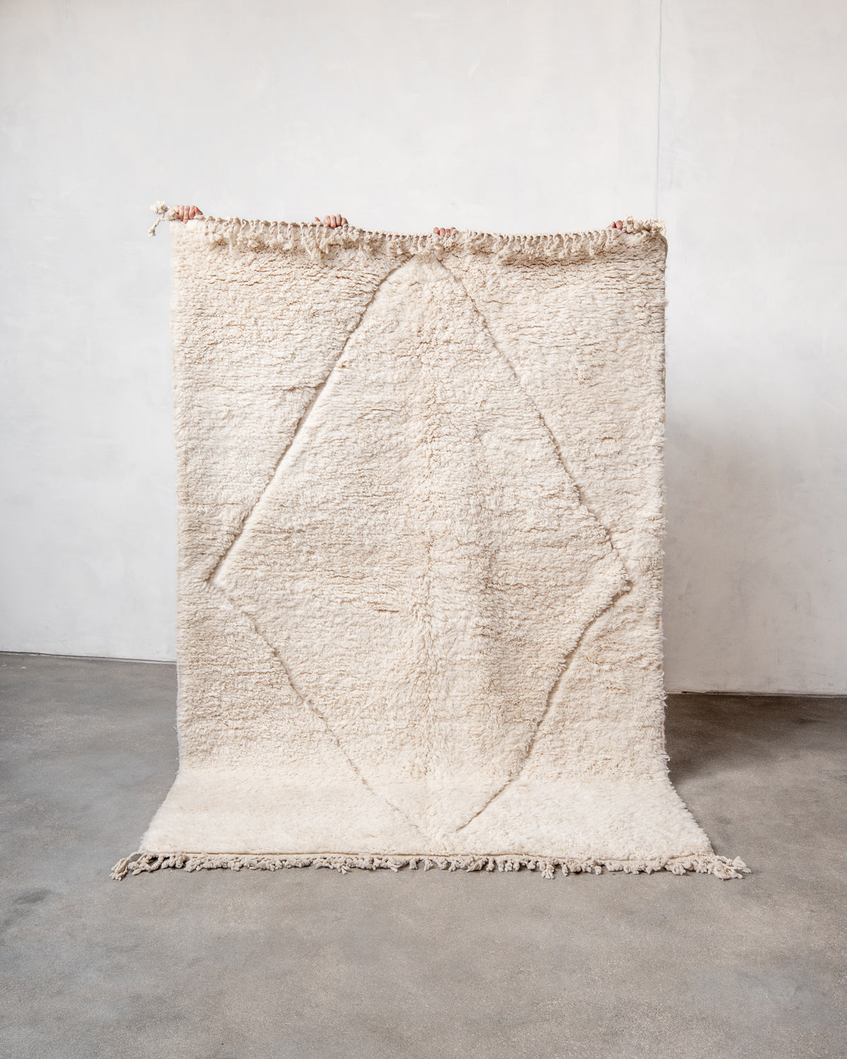 Modern, designer, handcrafted Berber rug from Morocco. Beniourain carpet with minimalist design, natural wool pile and a fluffy texture.