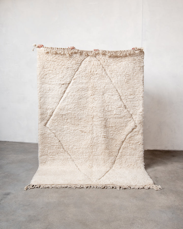 Modern, designer, handcrafted Berber rug from Morocco. Beniourain carpet with minimalist design, natural wool pile and a fluffy texture.