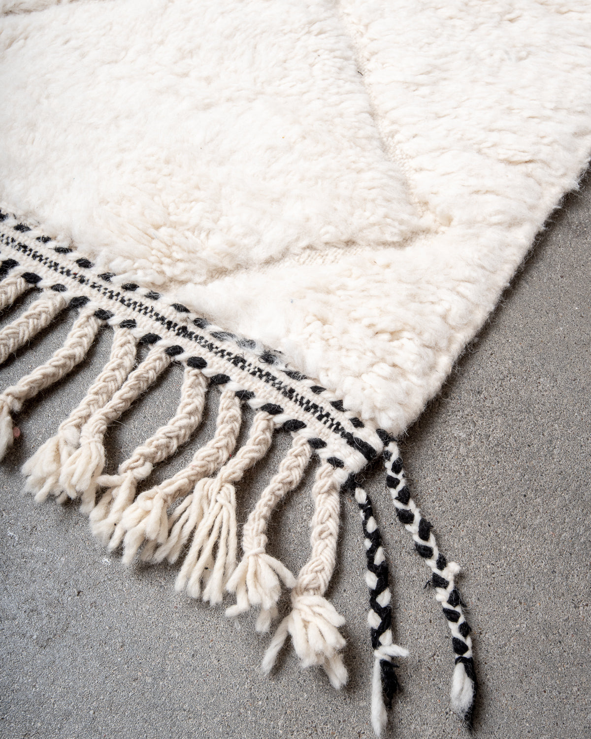 Modern, designer, handcrafted Berber rug from Morocco. Beniourain carpet with minimalist design, natural wool pile and a fluffy texture.