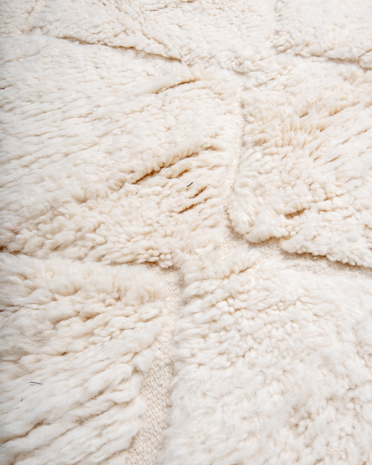 Modern, designer, handcrafted Berber rug from Morocco. Beniourain carpet with minimalist design, natural wool pile and a fluffy texture.