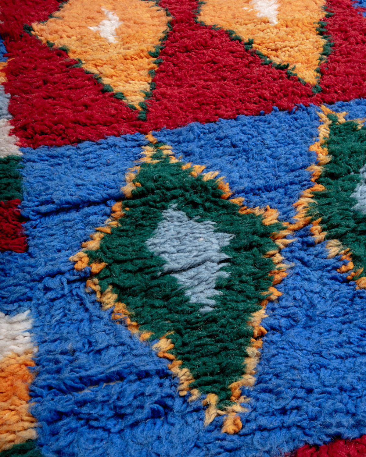 Modern, designer, handcrafted Berber runner rug from Morocco. Beniourain carpet with beautiful colours and patterns and fluffy wool texture.