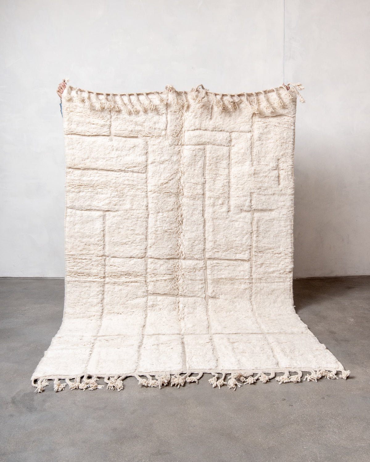 Modern, designer, handcrafted Berber rug from Morocco. Beniourain carpet with minimalist design, natural wool pile and a fluffy texture.