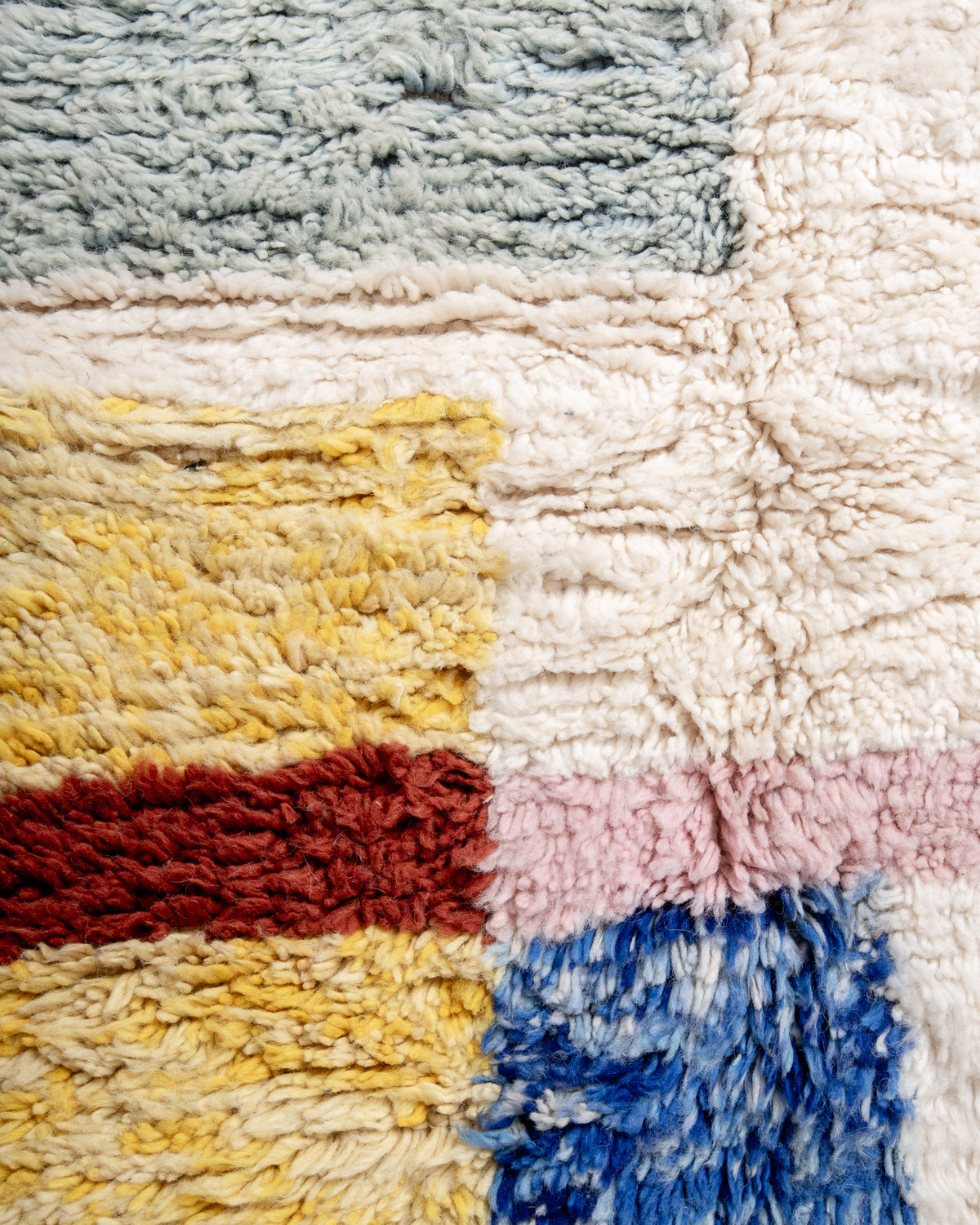 Modern, designer, handcrafted Berber rug from Morocco. Beniourain carpet with beautiful colours and patterns and fluffy wool texture.