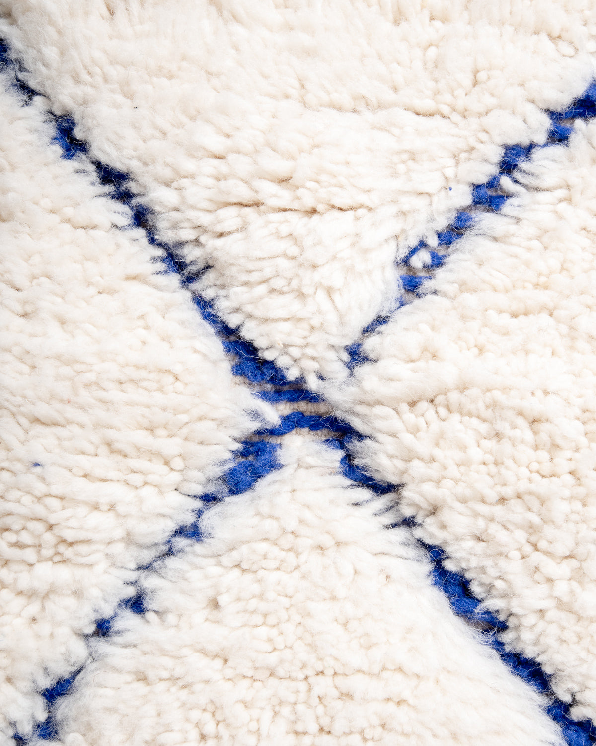 Modern, designer, handcrafted Berber rug from Morocco. Beniourain carpet with beautiful colours and patterns and fluffy wool texture.