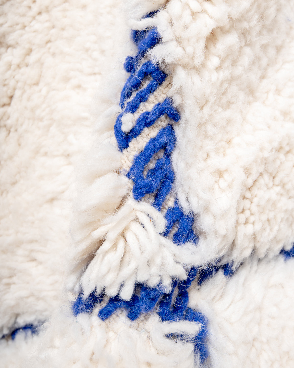 Modern, designer, handcrafted Berber rug from Morocco. Beniourain carpet with beautiful colours and patterns and fluffy wool texture.