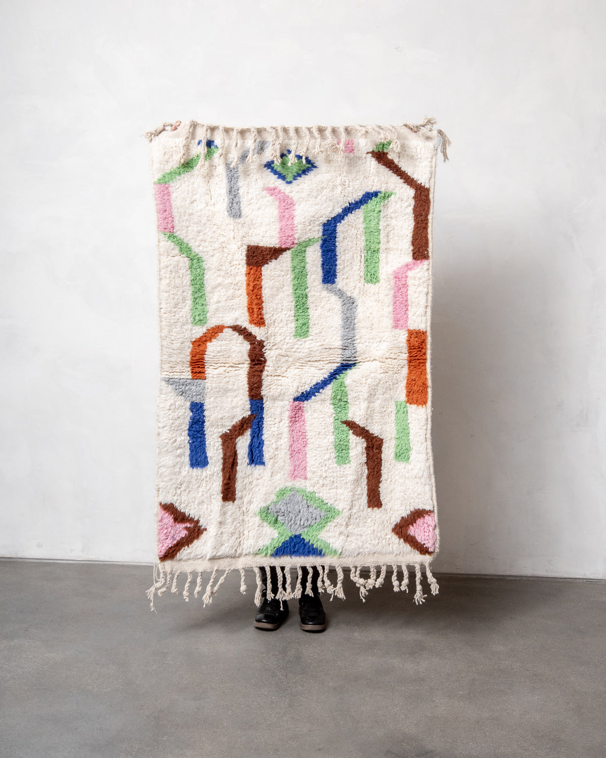 Modern, designer, handcrafted Berber rug from Morocco. Beniourain carpet with beautiful colours and patterns and fluffy wool texture.