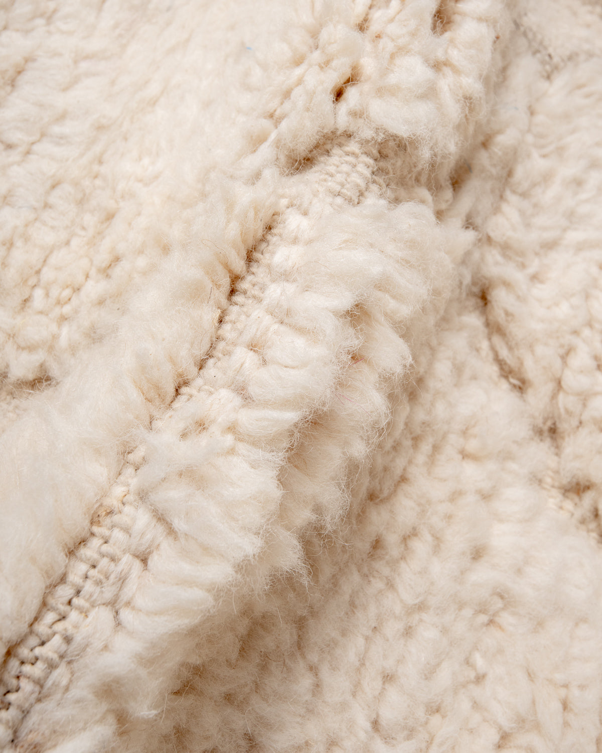 Modern, designer, handcrafted Berber rug from Morocco. Beniourain carpet with minimalist design, natural wool pile and a fluffy texture.