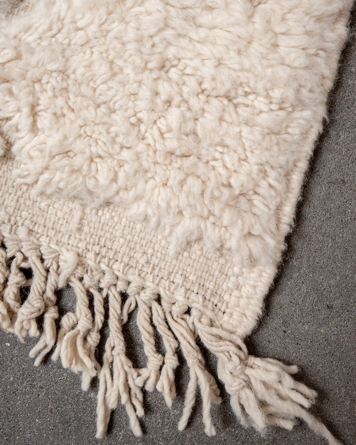 Modern, designer, handcrafted Berber rug from Morocco. Beniourain carpet with minimalist design, natural wool pile and a fluffy texture.