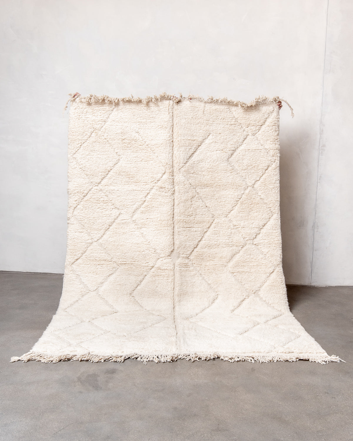 Modern, designer, handcrafted Berber rug from Morocco. Beniourain carpet with minimalist design, natural wool pile and a fluffy texture.