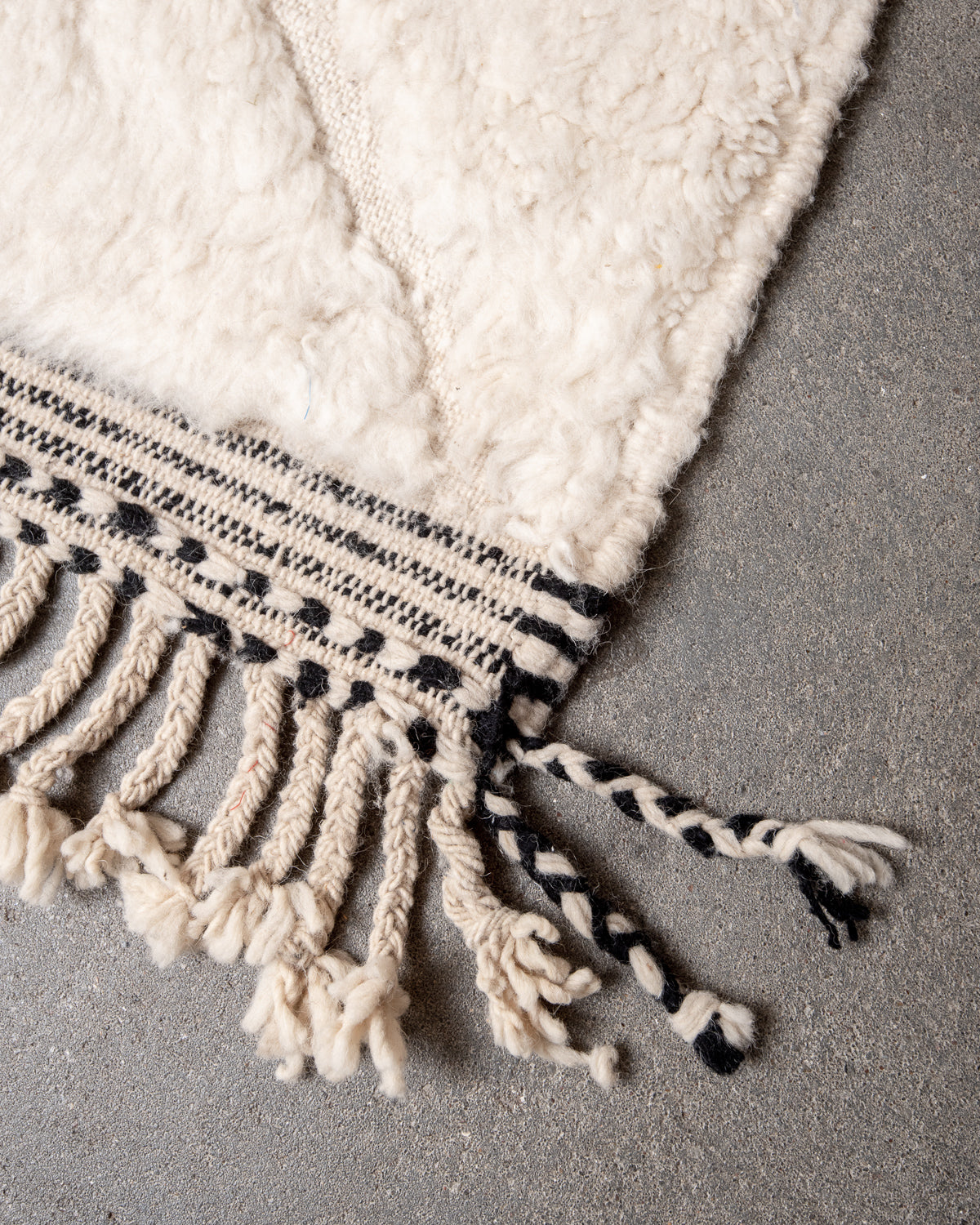 Modern, designer, handcrafted Berber rug from Morocco. Beniourain carpet with minimalist design, natural wool pile and a fluffy texture.