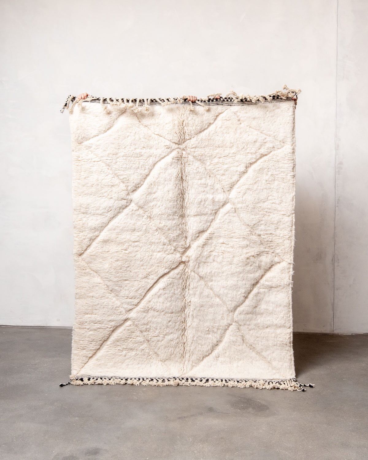 Modern, designer, handcrafted Berber rug from Morocco. Beniourain carpet with minimalist design, natural wool pile and a fluffy texture.