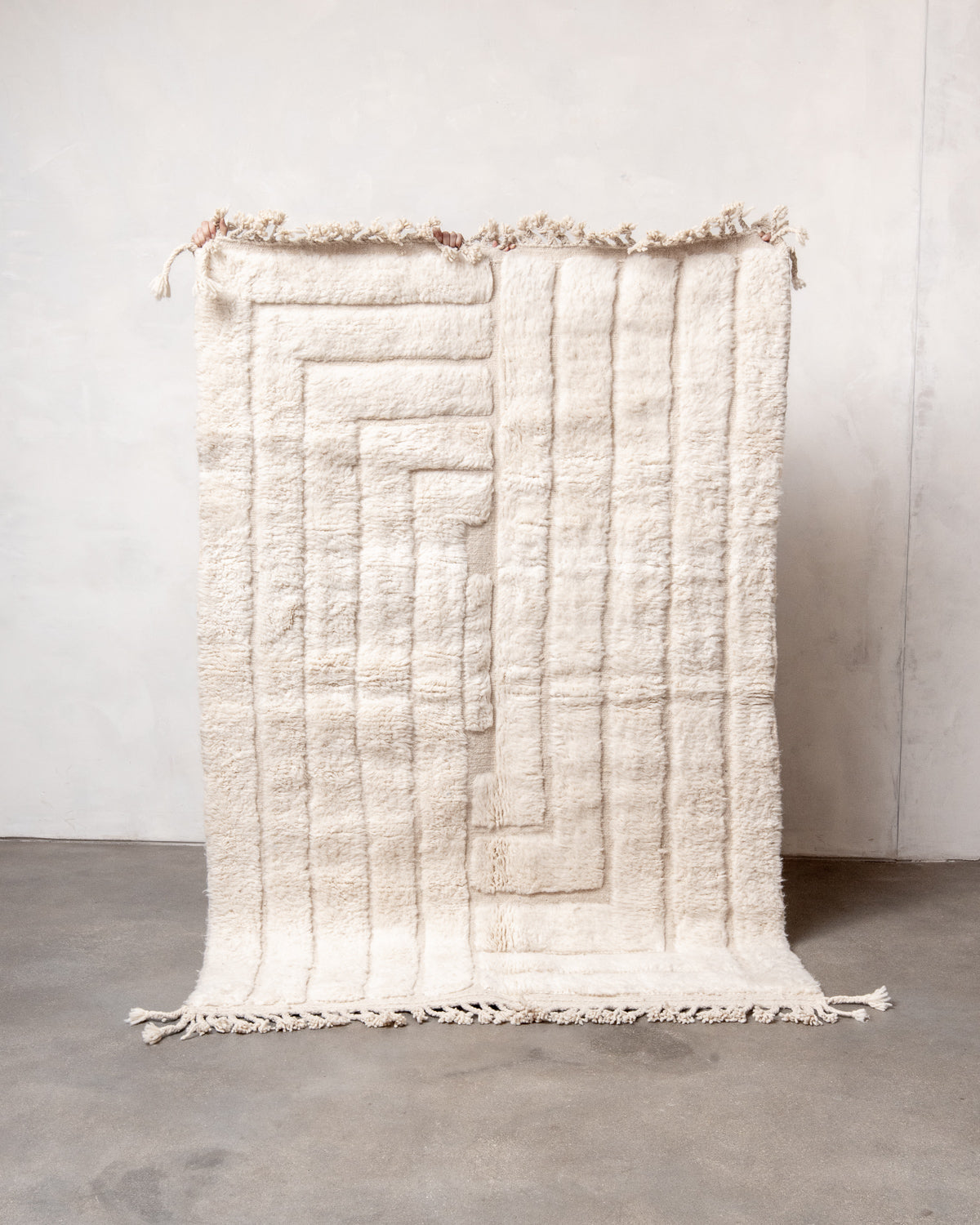 Modern, designer, handcrafted Berber rug from Morocco. Beniourain carpet with minimalist design, natural wool pile and a fluffy texture