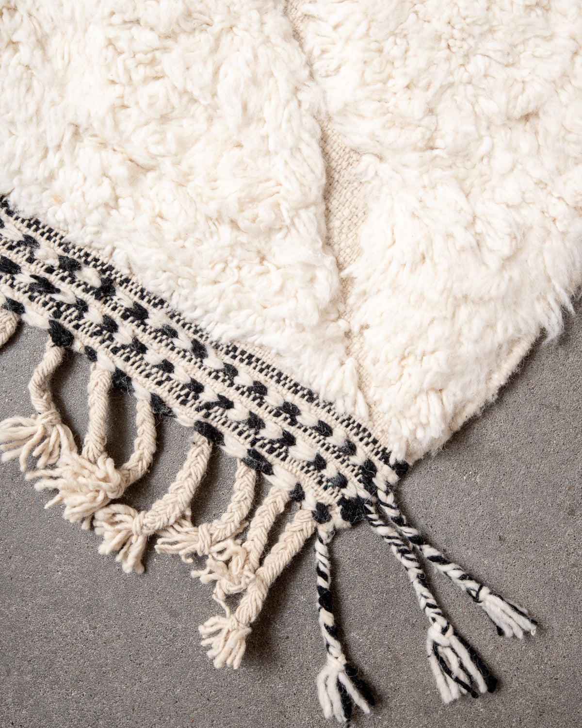 Modern, designer, handcrafted Berber rug from Morocco. Beniourain carpet with minimalist design, natural wool pile and a fluffy texture.