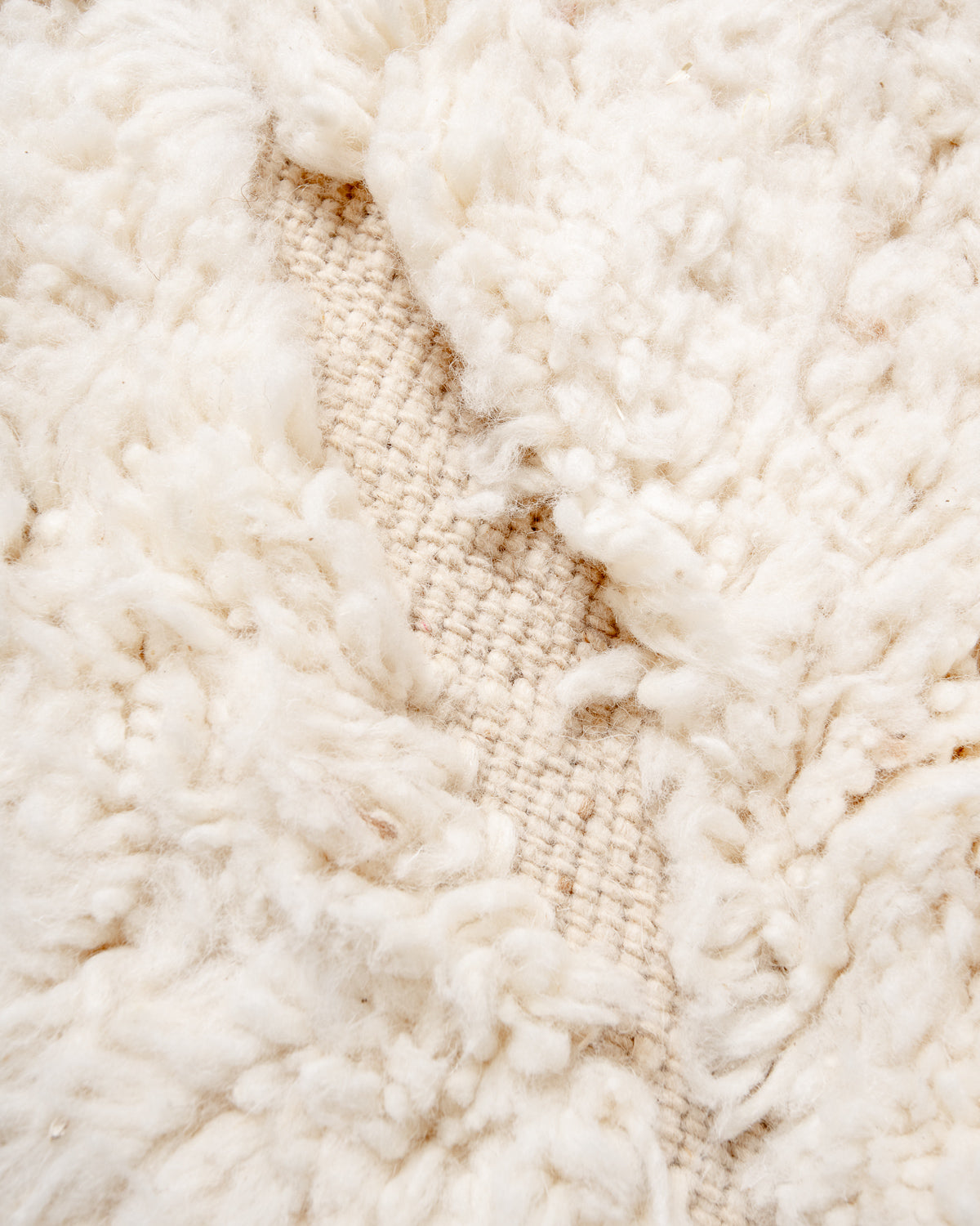 Modern, designer, handcrafted Berber rug from Morocco. Beniourain carpet with minimalist design, natural wool pile and a fluffy texture.