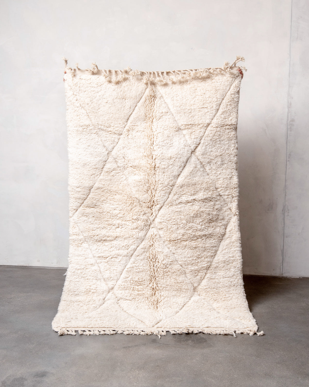 Modern, designer, handcrafted Berber rug from Morocco. Beniourain carpet with minimalist design, natural wool pile and a fluffy texture