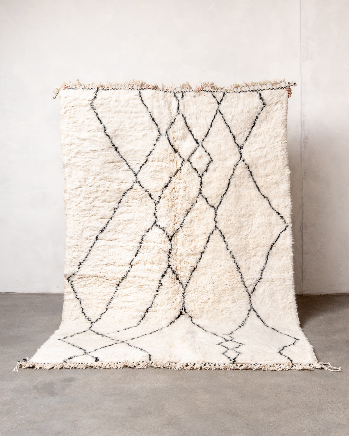 Modern, designer, handcrafted Berber rug from Morocco. Beniourain carpet with minimalist design, natural wool pile and a fluffy texture.