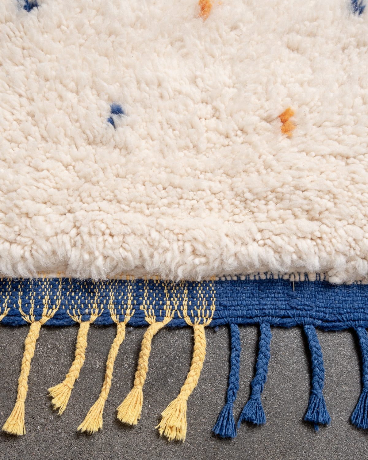 Modern, designer, handcrafted Berber rug from Morocco. Beniourain carpet with beautiful colours and patterns and fluffy wool texture.