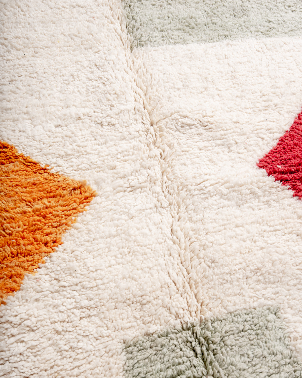 Modern, designer, handcrafted Berber rug from Morocco. Beniourain carpet with beautiful colours and patterns and fluffy wool texture.