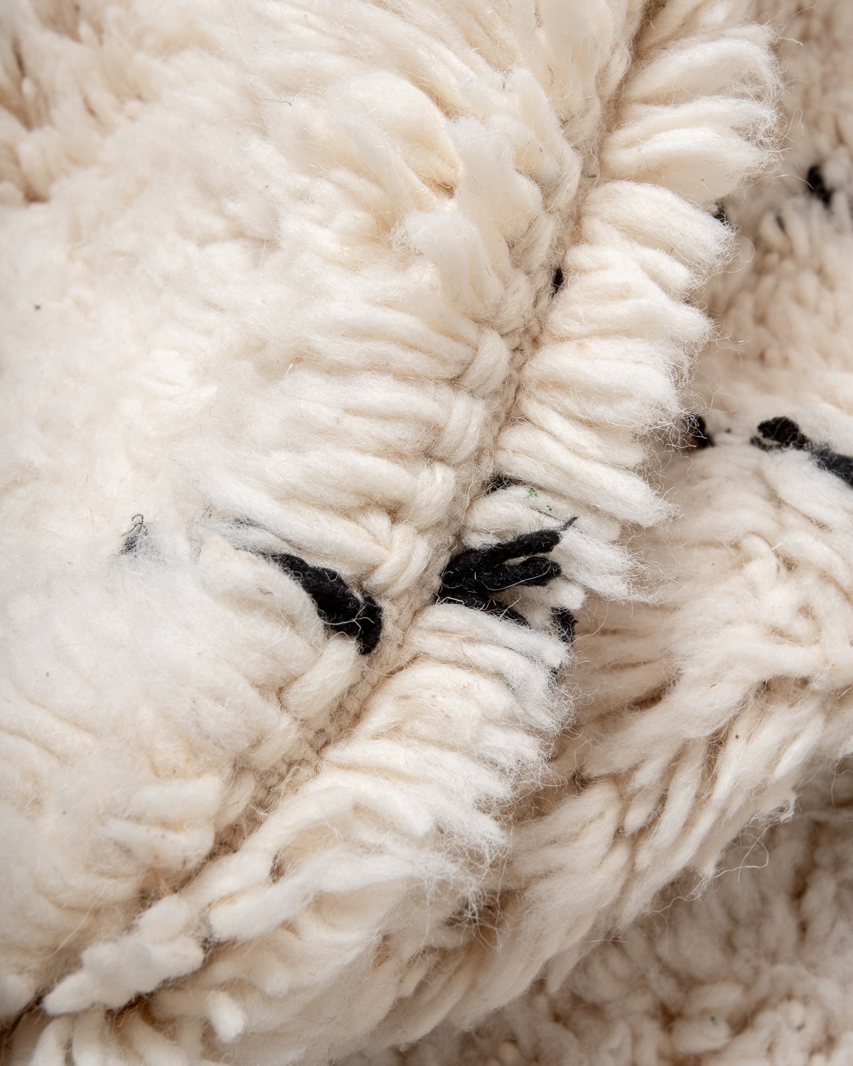 Modern, designer, handcrafted Berber rug from Morocco. Beniourain carpet with minimalist design, natural wool pile and a fluffy texture.