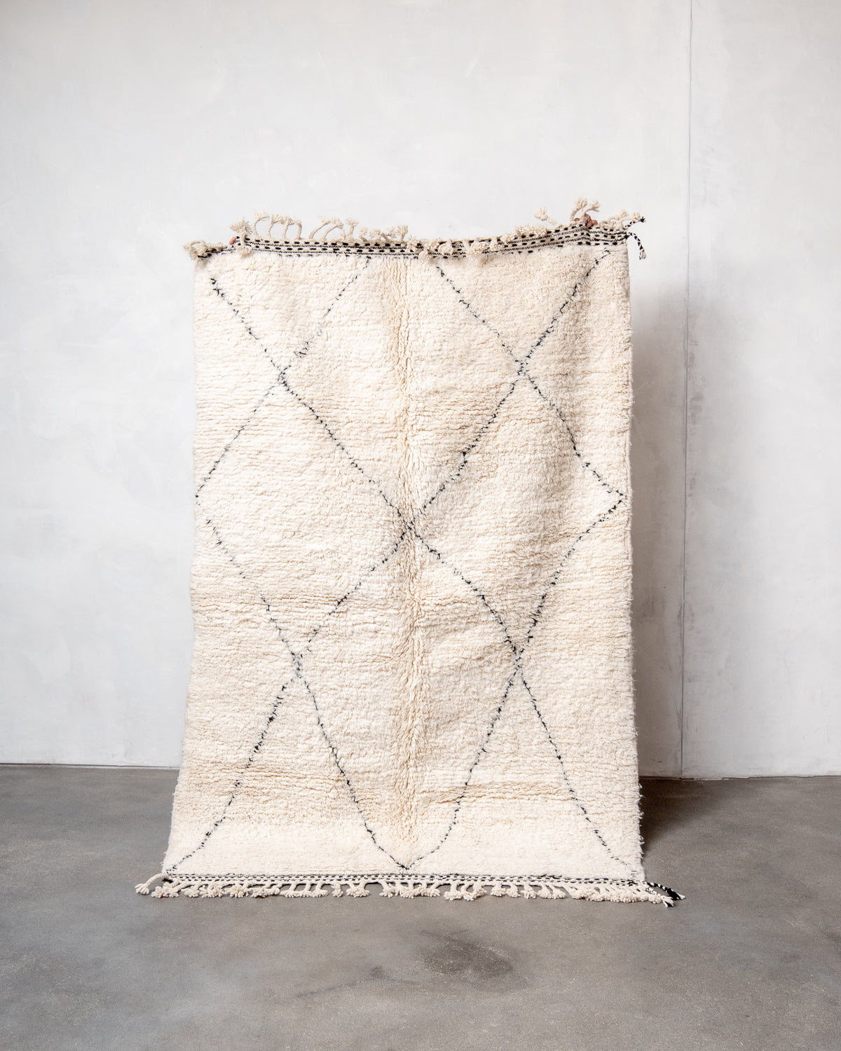 Modern, designer, handcrafted Berber rug from Morocco. Beniourain carpet with minimalist design, natural wool pile and a fluffy texture.