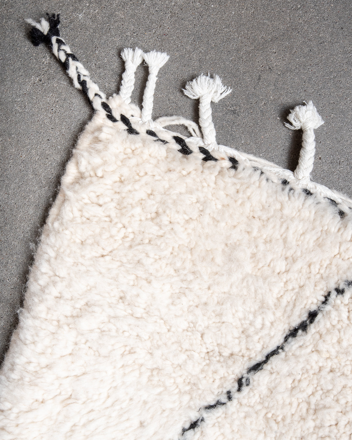 Modern, designer, handcrafted Berber rug from Morocco. Beniourain carpet with minimalist design, natural wool pile and a fluffy texture.