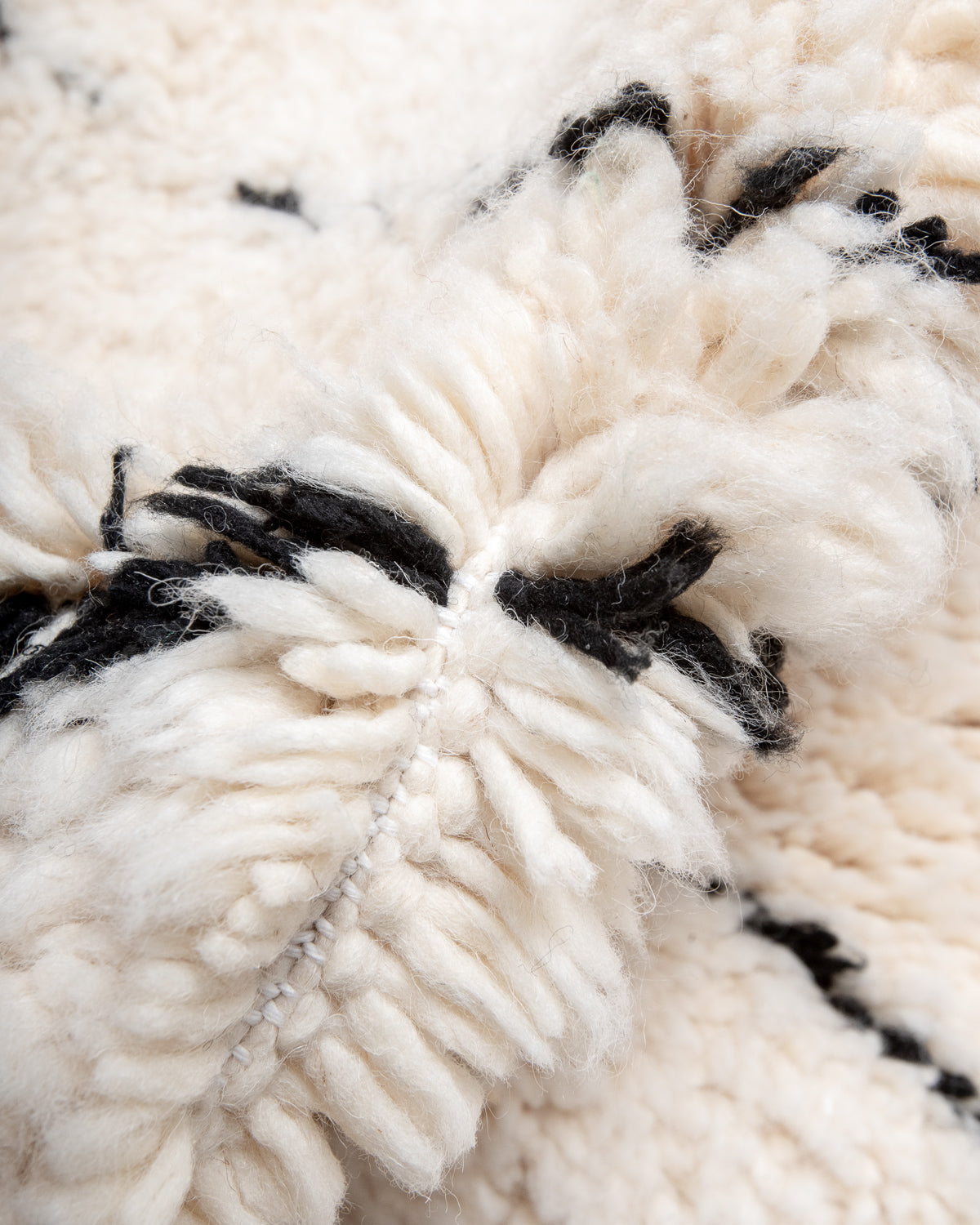 Modern, designer, handcrafted Berber rug from Morocco. Beniourain carpet with minimalist design, natural wool pile and a fluffy texture.