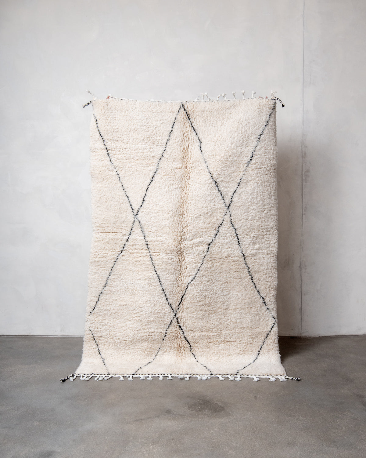 Modern, designer, handcrafted Berber rug from Morocco. Beniourain carpet with minimalist design, natural wool pile and a fluffy texture.