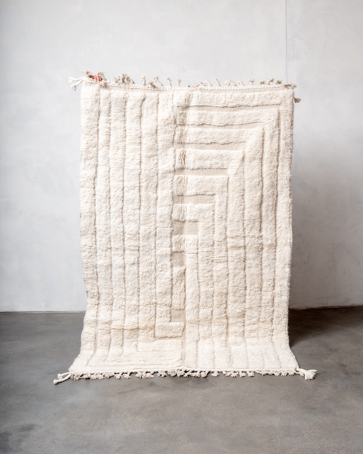 Modern, designer, handcrafted Berber rug from Morocco. Beniourain carpet with minimalist design, natural wool pile and a fluffy texture.