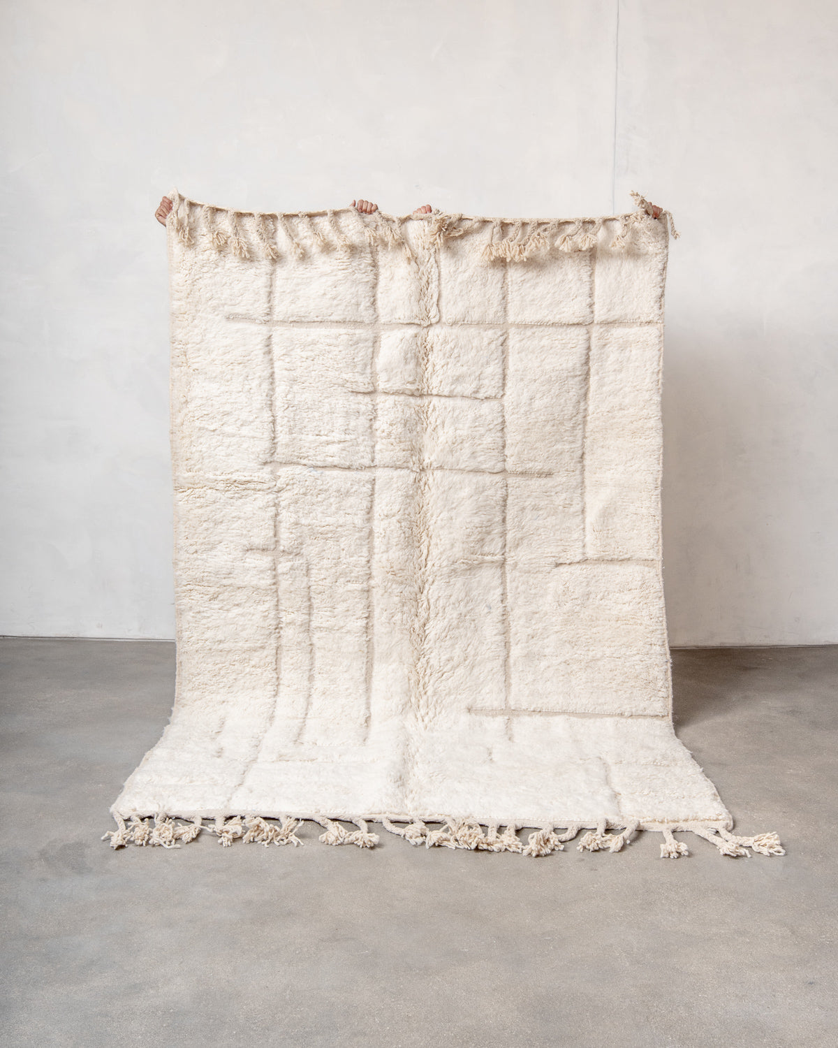 Modern, designer, handcrafted Berber rug from Morocco. Beniourain carpet with minimalist design, natural wool pile and a fluffy texture.