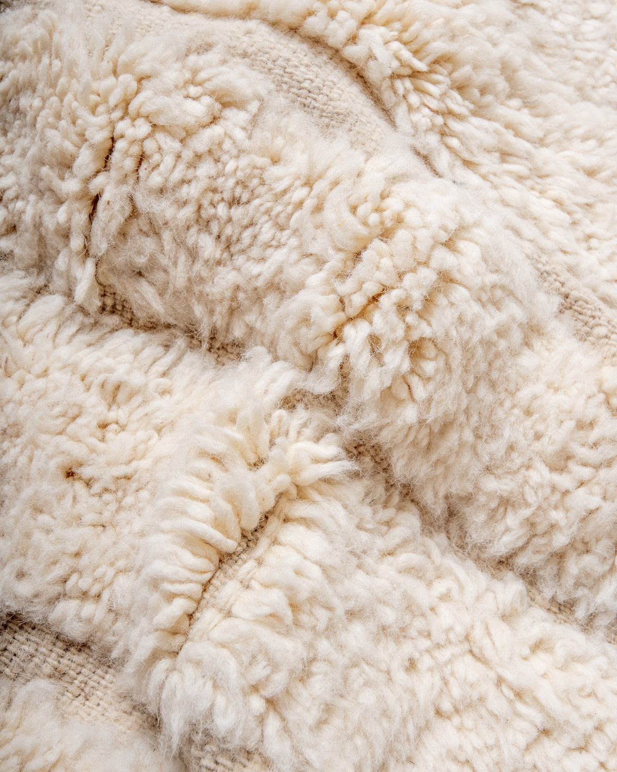 Modern, designer, handcrafted Berber rug from Morocco. Beniourain carpet with minimalist design, natural wool pile and a fluffy texture.