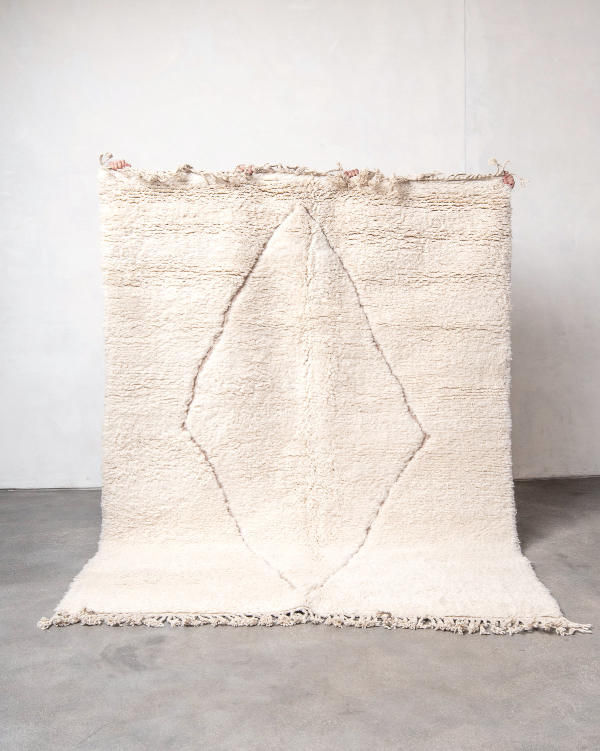 Modern, designer, handcrafted Berber rug from Morocco. Beniourain carpet with minimalist design, natural wool pile and a fluffy texture.