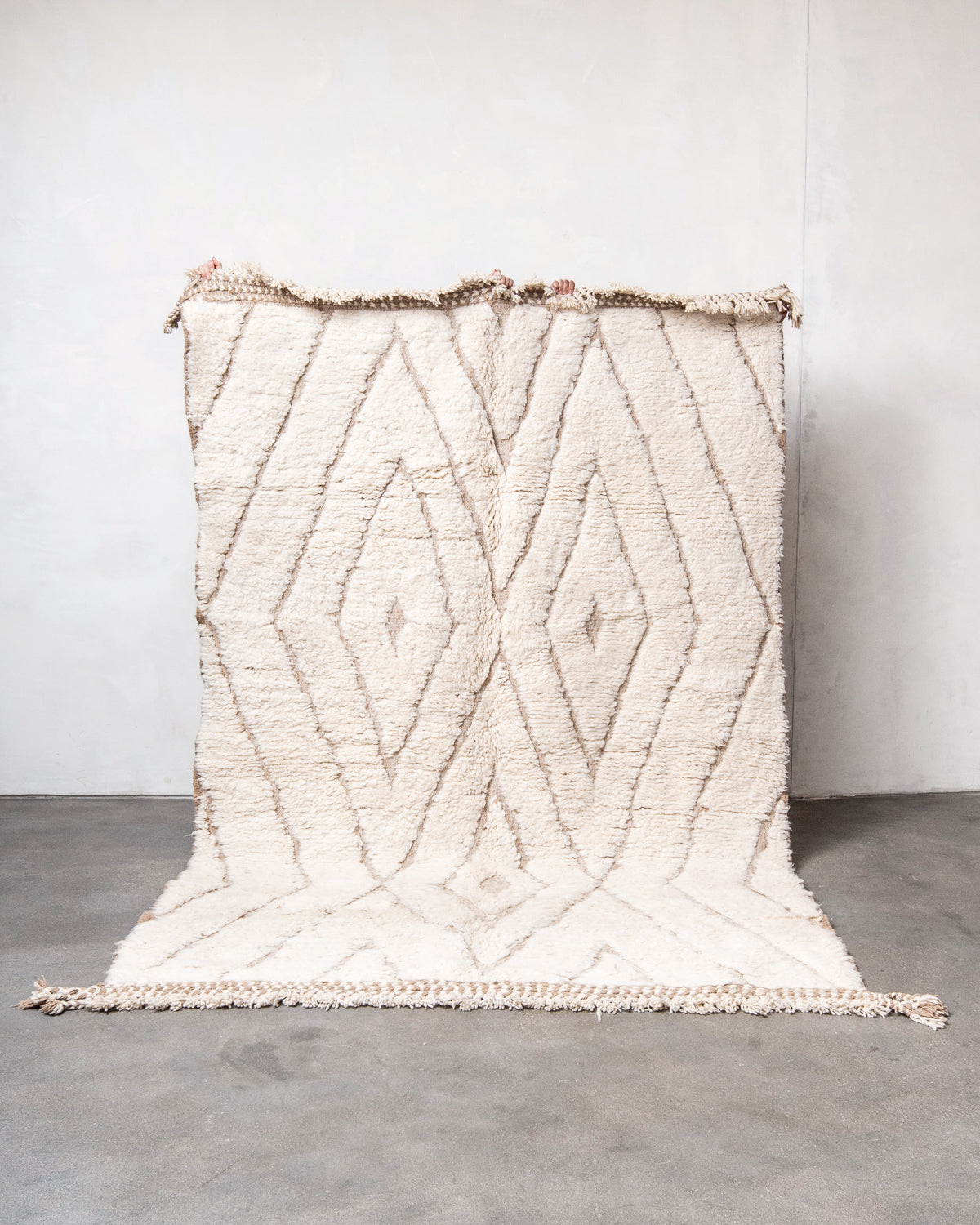 Modern, designer, handcrafted Berber rug from Morocco. Beniourain carpet with minimalist design, natural wool pile and a fluffy texture.